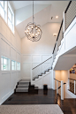 Inspiration for a large country dark wood floor and black floor entryway remodel in Boston with white walls and a black front door