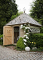 Garden shed  I love the big bold clematis   growing up the side.