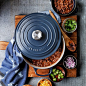 Le Creuset cookware has been made in France since 1925. Each piece is cast in an individual sand mold and passes through the hands of 15 skilled craftsmen before being coated with a brightly pigmented enamel glaze that gives it it's signature color.: 