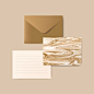 Brown envelope with letter and marble abstract postcard