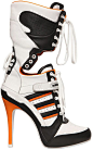 120mm Orange rubberized leather cover heel. 20mm Internal platform. Reinforced eyelets. Velcro strap closure. Back lace up detail. Techno lining. Rubber sole