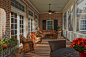 This is an example of a traditional screened-in back porch design in Charleston with decking and a roof extension.