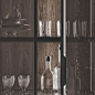 Island kitchen with a black ceramic countertop | Order and practicality are ensured by drawers and deep drawers with tableware and cookware dividers and flatware organisers in Canaletto Oak. The groove that continues along the side and onto the ceramic fi