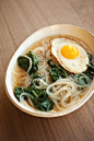 Spinach noodle soup with fried egg