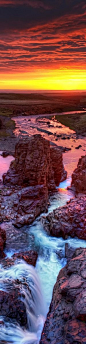 The waterfall cavern at sunset in Northern Iceland.