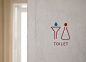 THE SIGNAGE FOR RESTROOMS ARE DESIGNED LIKE EXPERIMENTAL TOOLS.