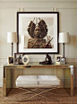 Global Chic - Red Cross Showhouse - Traditional Home Magazine - Behind the desk, a large black-and-white portrait of an African Maasai warrior serves as an eye-catching focal point.