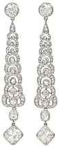Art Deco Diamond Earrings, circa 1930. A pair of Art Deco diamond pendant earrings of articulated, tapering design, terminating in a square cut diamond suspending a round diamond, in platinum. France. Color: J-K, Clarity: VS-1/VS-2, Approximate total diam