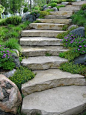 Beautiful stone steps would be nice for that steep hill on the side of the house: 