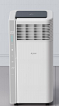 This may contain: a white air conditioner sitting on top of a floor