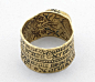 Love-ring; gold; engraved; broad flat hoop divided horizontally by milled band, inscription on exterior, inscribed interior depicts woman and squirrel among flowers and foliage; circular bezel containing sapphire bead.