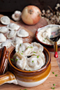 Classic Russian dumplings - Pelmeni with juicy meat filling is a true comfort food. Serve garnished with butter, sour cream and parsley: