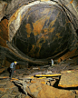 This may contain: two people standing in the middle of a large rock formation with an instagram message below