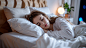 ls7623_Young_woman_sleeping_in_bed_with_pillow_and_white_sheets_4f9872ea-785e-4c4b-9dff-64a043495d19