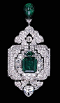 wAN IMPRESSIVE EMERALD AND DIAMOND PENDANT/BROOCH, BY CARTIER Designed as an old European and old mine-cut diamond openwork panel with a central rectangular-cut emerald weighing 12.28 carats, suspending a diamond palmette and emerald bead drop, to the pea