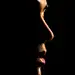 woman's face and lips coming out of shadows