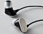 Nikon headset  Elements: Flat simple curved metal surface over black plastic.: 