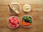 peanut butter and banana sandwich on sprouted grain bread, watermelon cubes, and broccoli and carrots with roasted garlic hummus