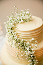 Baby's Breath Garland on Wedding Cake |  See the wedding on Style Me Pretty: http://www.StyleMePretty.com/california-weddings/2014/02/17/mankas-boathouse-wedding-with-a-bowtie-bar/ Larissa Cleveland Photography