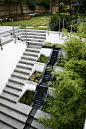 RADLETT RESIDENTIAL LANDSCAPE • CONCEPT Landscape Architects, Urban and Garden Designers London : Modern residential garden design with split level terraces and water feature cascade.