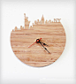 New York Modern Wall Clock By iluxo Jewelry and Design. Cherry bamboo wood wall clock with the Statue of Liberty, Empire State Building and more iconic pieces of the NYC skyline.: