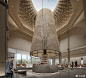 This may contain: a man is walking through the lobby of a large building with an intricate design on it