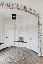 Inspiration for a small country medium tone wood floor and brown floor entryway remodel in Other with beige walls