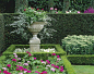Plant flowers in the center of shrubs and add height for a focal point: 