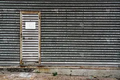 Closeup of a metal gate typically found on buildings
