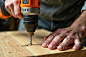 Man drilling wood with drill