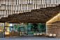 kengo kuma clads campus building with layered timber slats
