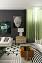 So many textures and patterns in this living space. We love those dramatic, sheer green curtains.: 