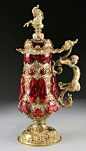 A GERMAN BAROQUE STYLE GILT METAL AND RUBY GLASS TANKARD 19th Century