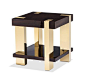Geometric and bold, the Jordan Side Table pairs smoked eucalyptus wood with brass-finished stainless steel and the result is stunning. Dimensions: 24"H x 23"H x 23"W Material: stainless steel/ wood veneer Finish: brass / smoked figured euca