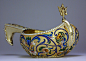 A gilded silver and cloisonne enamel Imperial presentation kovsh in 17th century style by Lubavin (silversmith of the Czarist Court), made in St. Petersburg between 1899 and 1902, of traditional boat shape with a hook handle, surmounted with a double-head