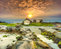 日落海岸石头小屋风景图片
