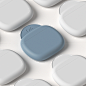 This may contain: several white and blue objects are arranged in the shape of hearts on a light gray surface