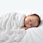 A_baby_sleeping_on_a_white_sheet_on_a_simple_white_backgr_3e303816-0609-4d5f-b75a-7c656991959e