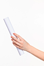 white-cylinder-props-female-hands-white-background_155003-20491