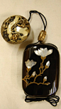 Magnolia blossoms. Japanese netsuke (manju) made of carved ivory; also silver, gold.