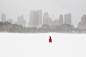 Person walking in snow in Sheep Meadow