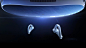 This may contain: two white headphones sitting next to each other on a black surface in the dark