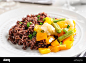 plate-with-delicious-brown-rice-and-vegetables-closeup-TW67KY
