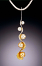 “South Sea Glow” by Adam Neeley (won 2010 intl pearl design competition) -- Three golden South Sea cultured pearls and two white Akoya cultured pearls (starting from 11.5mm and ending at 4.5mm). Hand fabricated in Elektra Gold which transitions from rich 