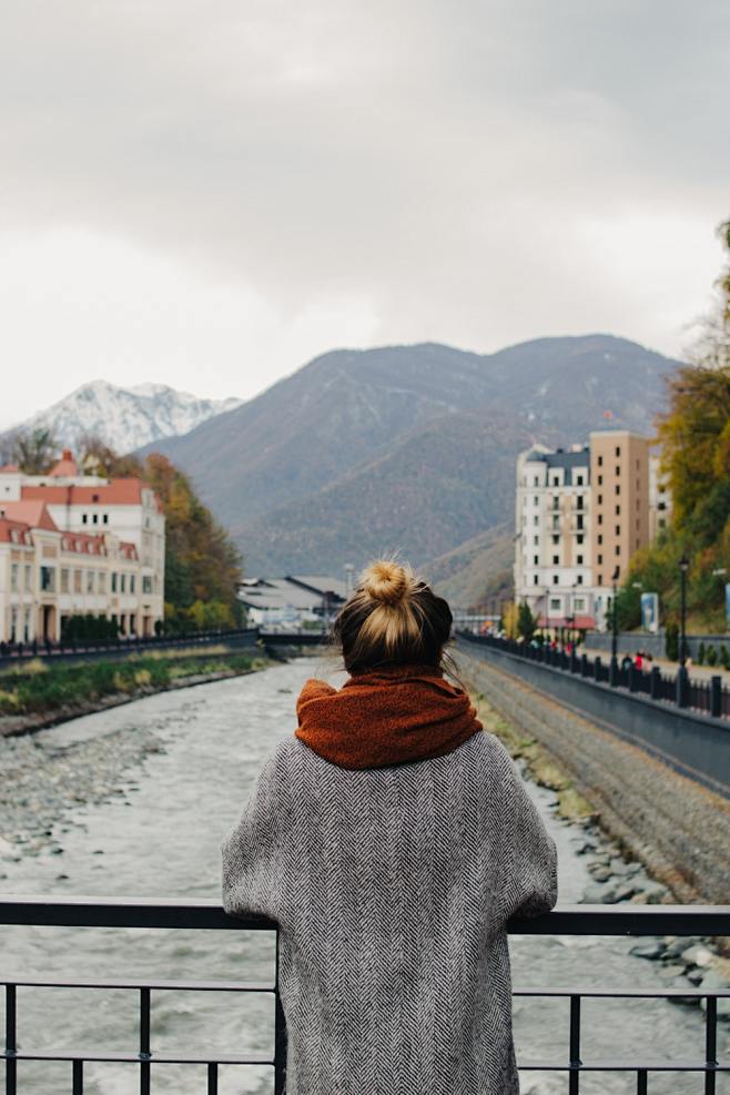 woman in gray coat l...