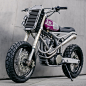 the husqvarna TE570 custom motorcycle by motomucci : a bespoke subframe forms the TE570's center point, arching the rider’s center of gravity towards the bike's center, while creating more visual space around the rear wheel.