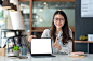 asian-businesswoman-working-using-tablet-blank-white-screen-office-looking-camera_928131-4705