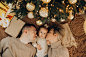 family-with-baby-daughter-by-christmas-tree
