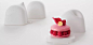 PIERRE HERMÉ PARIS
美术指导：原 研哉 
设计人员：原 研哉、三泽 遥 
这是为PIERRE HERMÉ PARIS的“ISPAHAN”蛋糕设计的包装。用手捏纸黏土，最后用砂纸打磨，其特点是没有接缝的曲线，材质极为细腻。