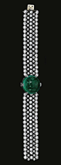 FINE  EMERALD  AND  DIAMOND  BRACELET,  CIRCA  1915      Centring  on  a  circular  cabochon  emerald  highlighted  with  circular-  and  single-cut  diamond  set  motifs,  to  an  articulated  wide  band  designed  as  an  open  work  mesh  collet-set  w